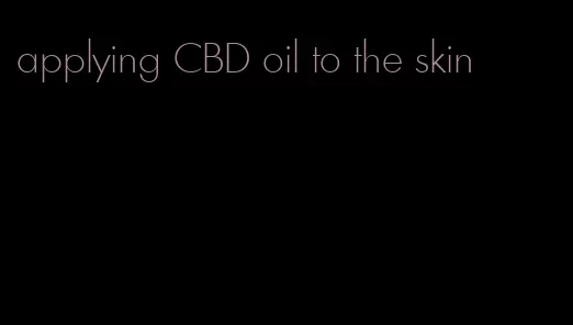 applying CBD oil to the skin